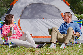 Couple outside tent